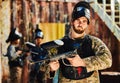 Paintball, serious or portrait of man with gun in shooting game playing in action battlefield mission. War, hero or Royalty Free Stock Photo