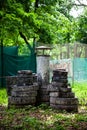 Paintball shooting range. Paintball territory in the forest. Iron barrels in the foreground with multi-colored blots Royalty Free Stock Photo