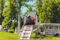 Paintball sport player in protective uniform and mask playing with gun outdoors. Royalty Free Stock Photo