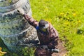 Paintball sport player in protective uniform and mask playing with gun outdoors. Royalty Free Stock Photo