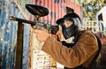 Paintball, target practice or man with gun in shooting game playing with on fun battlefield mission. Aim or focused male