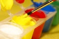 Paintbrush diped into the yellow colour Royalty Free Stock Photo