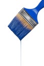 A paintbrush dripping with blue paint Royalty Free Stock Photo