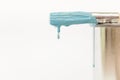 Paintbrush dripping blue paint Royalty Free Stock Photo