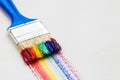 Paintbrush and multicolor rainbow brush strokes on artist Royalty Free Stock Photo