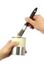 Paintbrush and Paint Can Held by Hands Royalty Free Stock Photo