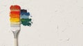 A paintbrush with a rainbow of colors on a white background. Royalty Free Stock Photo