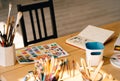 Paintbrush with tubes of oil paints and colour pencils. Art and craft tools,ink,wooden table.painting for contemporary artist`s. Royalty Free Stock Photo