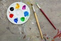 Paintbrush and watercolor paint, palettes on the table smear the color,education and art object,top view