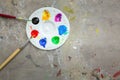 Paintbrush and watercolor paint, palettes on the table smear the color,education and art object,top view