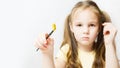 paintbrush on white background with little girl. copy space. Shallow depth of field Royalty Free Stock Photo