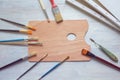 Paintbrushes, canvases and palette on table. Copy space