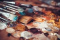 Paintbrushes closeup, palette and multicolor paint stains Royalty Free Stock Photo