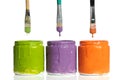 Paintbrushes Dripping Paint into Containers