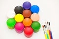 Paintbrushes and gouaches of different colors Royalty Free Stock Photo