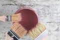 Paintbrushes and paint can in a wood background Royalty Free Stock Photo
