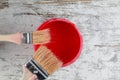 Paintbrushes and paint can in a wood background Royalty Free Stock Photo