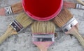 Paintbrushes and paint can in a wood background Royalty Free Stock Photo