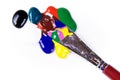 Paintdrops of different colours and paintbrush Royalty Free Stock Photo