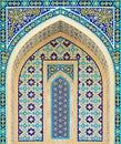 Painted Arabic patterns, in the form of an arch on the brick wall of the mosque.