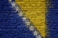 painted big national flag of bosnia and herzegovina on a massive old brick wall Royalty Free Stock Photo