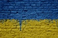 painted big national flag of ukraine on a massive old brick wall Royalty Free Stock Photo