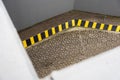 Painted black and yellow warning chevron on step