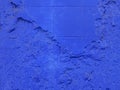 Painted blue textured concrete and brick wall. Royalty Free Stock Photo