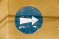 Painted blue and white one way sign on a street wall Royalty Free Stock Photo