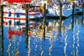 Painted Boat harbor on the island of Ruegen. Colorful reflection in the water Royalty Free Stock Photo