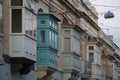 Rabat medieval village street view building in Malta painted bow windows