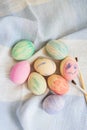 Painted bright and multi-colored Easter eggs on the background of a linen tablecloth, eggs painted with watercolors Royalty Free Stock Photo