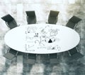 Painted business scheme on oval white conference table with black leather chairs on concrete floor Royalty Free Stock Photo