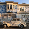 A painted car that comes with a matching home