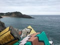 Painted cement breakwater blocks on the coast of Llanes