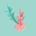 Painted Christmas tree with flowing paint on mint green background. Minimal holiday concept, isometric view