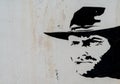 Painted Clint Eastwood cowboy mural on a wall in the Oasys Western Theme Park in the Tabernas Desert in Andalusia