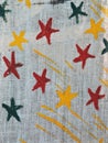 Painted colorful stars on linen fabric