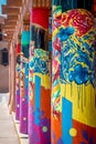 Colorful columns with blue flowers and abstract designs in Santa Fe New Mexico.