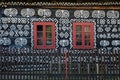 Painted decorations on wall of log house in Cicmany, Slovakia Royalty Free Stock Photo