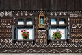 Painted decorations on wall of log house in Cicmany, Slovakia