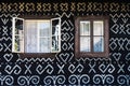 Painted decorations on wall of log house in Cicmany, Slovakia Royalty Free Stock Photo