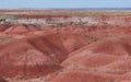 Red ochre sandstone layers eroded in v shaped valleys