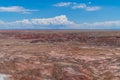 Painted Desert (Badlands) under blue cloudy sky in the Petrified Forest National Park, Arizona Royalty Free Stock Photo