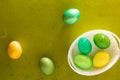 Painted Easter eggs basket on the old wooden background Royalty Free Stock Photo