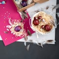 Painted Easter eggs in cardboard box and basket Royalty Free Stock Photo