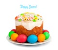 Painted Easter eggs and delicious cupcake on white isolated