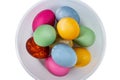 Painted easter eggs in a plastic plate on white isolated, top view of easter eggs Royalty Free Stock Photo