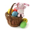 Painted Easter eggs and a rabbit in a basket Royalty Free Stock Photo