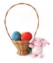 Painted Easter eggs and a rabbit in a basket Royalty Free Stock Photo